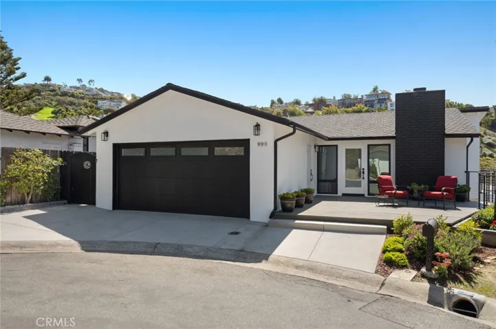   Ample parking is available in the driveway, located just beyond the two-car garage. This gorgeous, move-in-ready home is just moments from the upscale boutiques, galleries, cafés, and restaurants of Laguna Beach’s vibrant Village.