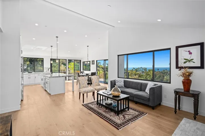  Bathed in natural light and cooled by gentle ocean breezes, the home also boasts extensive upgrades, including all-new plumbing and electrical systems, a new roof, a new HVAC system, a new tankless water heater, and an electric car charger.