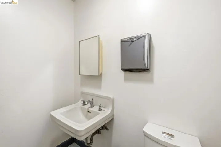 Half bath with toilet and a sink