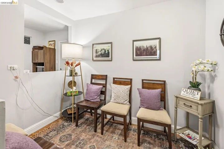 Sitting room featuring baseboards and wood finished floors