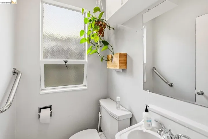 Half bath with toilet and a sink