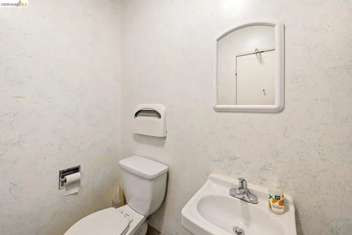 Half bath with toilet and a sink