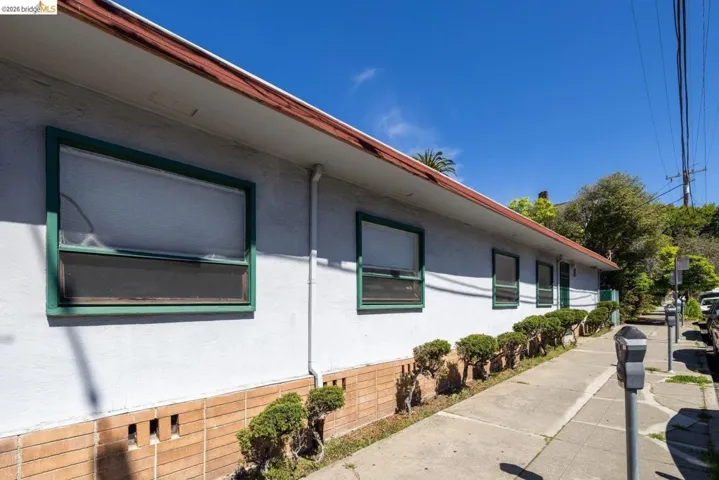 View of side of home featuring stucco siding
