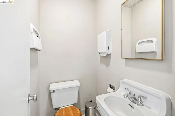 Half bathroom with toilet and a sink