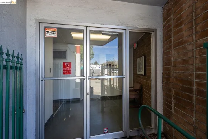 View of exterior entry featuring stucco siding