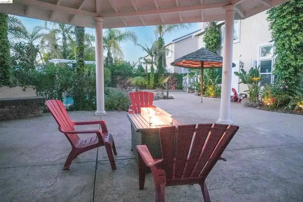 View of patio featuring an outdoor fire pit