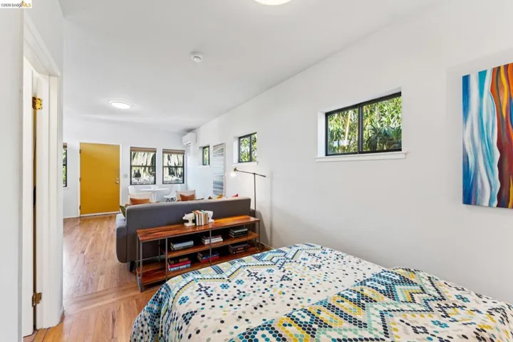 Bedroom featuring light wood-type flooring and a mini split for heating / cooling