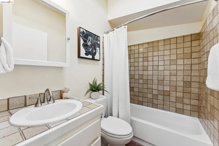 Bathroom featuring vanity and shower / bath combo