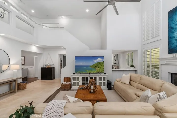 Entry living room with soaring ceilings.