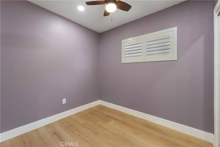 2nd Bedroom with Ceiling Fan, Designer Paint and Wood Shutters