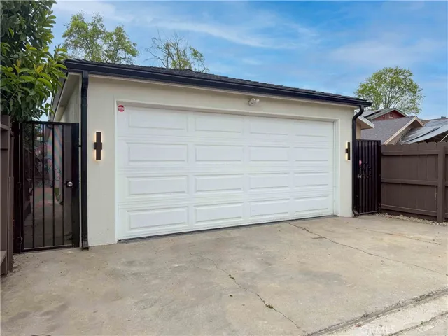 New Garage Door & Sleek Exterior Lights