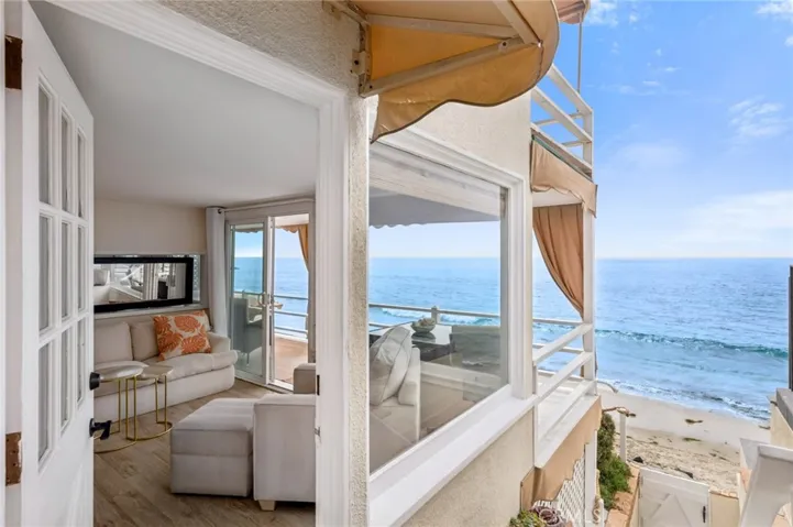 This light-filled 1-bedroom, 1-bath residence offers approximately 600 square feet with sweeping, panoramic ocean views that span from left to right, showcasing mesmerizing Catalina sunsets.