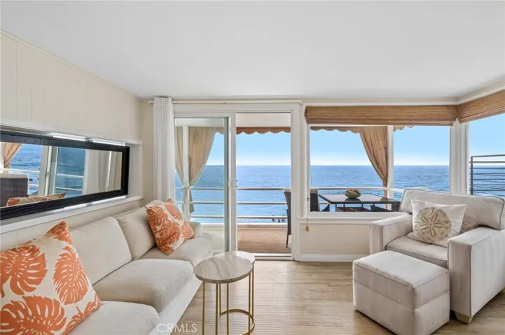  Upon entry, you’re immediately welcomed by an airy interior framed by sparkling coastal vistas, creating a seamless connection to the sea.