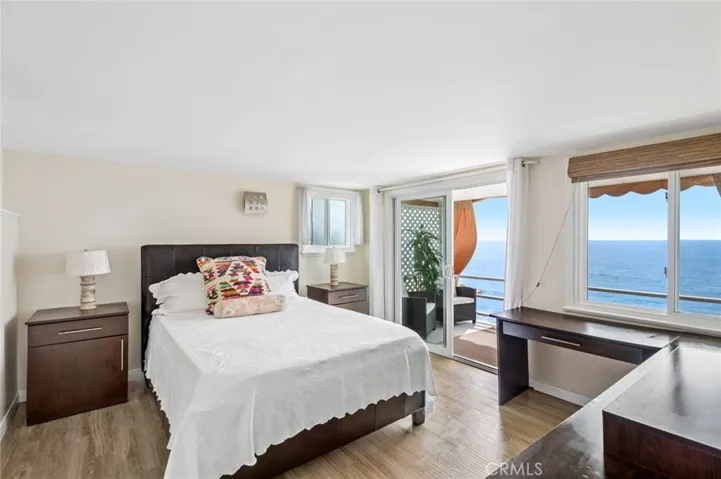 Thoughtfully designed, the home features a generous bedroom with a walk-in closet and a well-proportioned living space oriented to capture the ever-changing ocean backdrop.