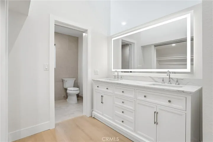 Primary Bathroom, duel sinks, pocket door to bathroom