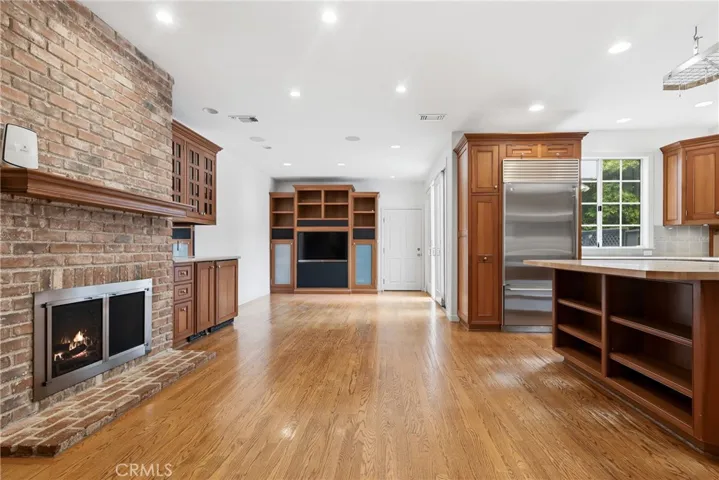 How cozy having a fireplace in the kitchen where everyone always gathers