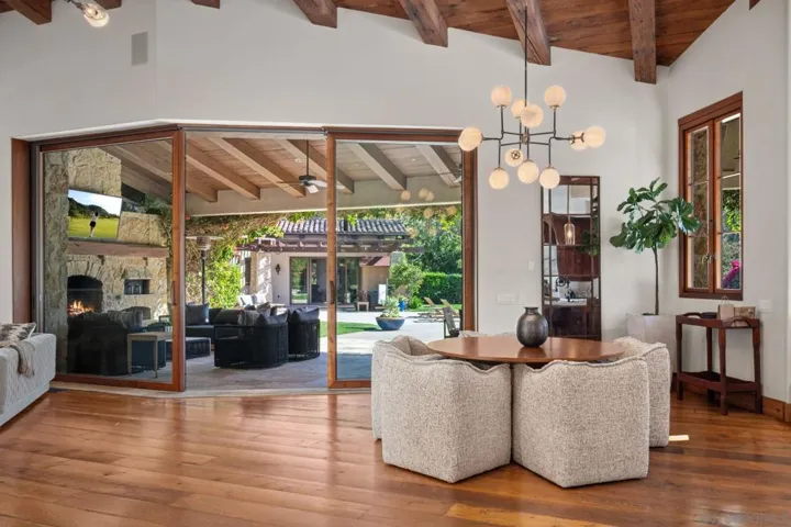 Custom, Weiland windows and doors throughout. Glass wall in family room completely disappears into a pocket.