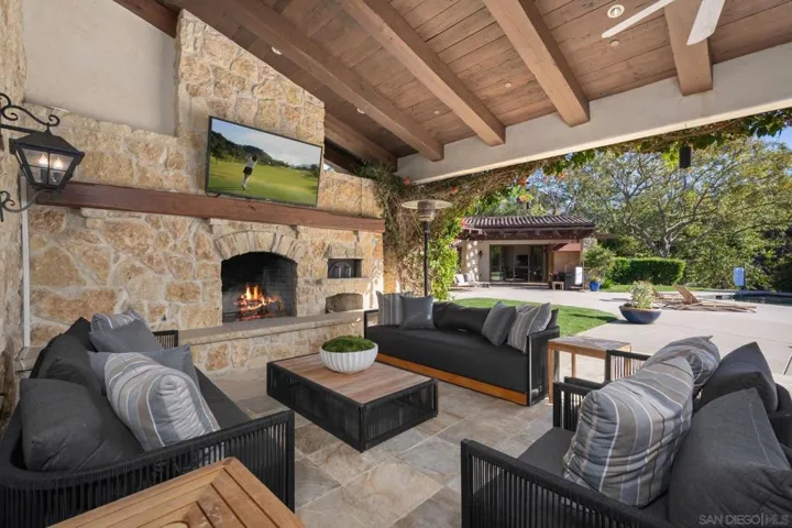 Seamless indoor/outdoor living. Outdoor fireplace is a great place to enjoy sunset complete with pizza oven and summer kitchen.