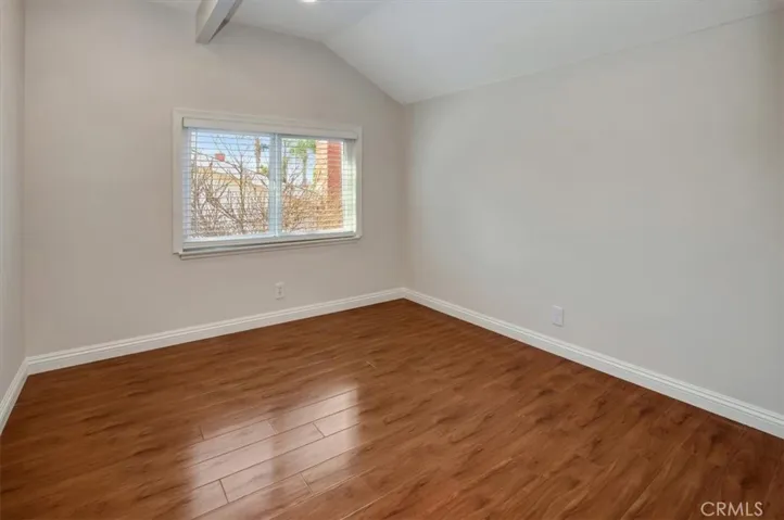 4th bedroom, window overlooking blossoming tree in season