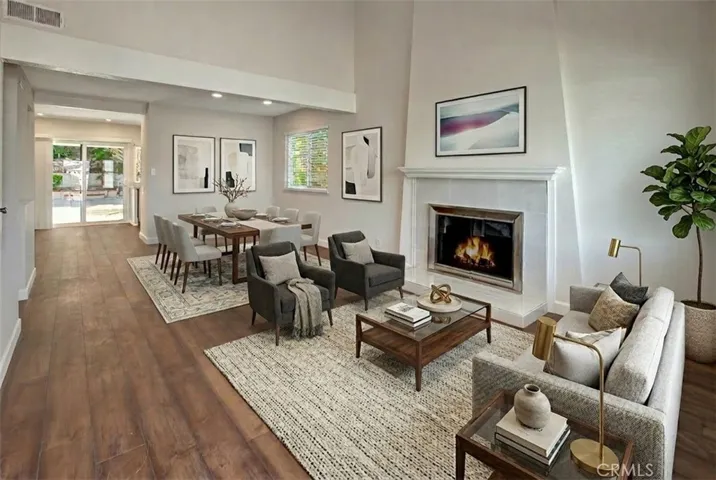 Virtually staged Living room and Dining room with cathedral ceiling
