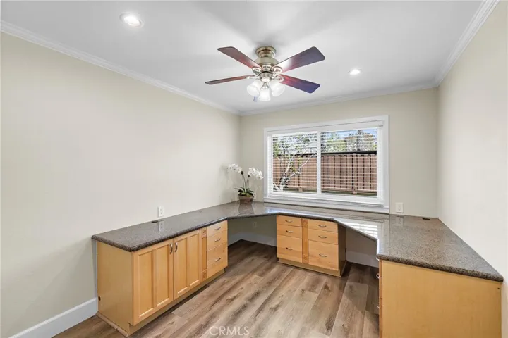 Home office with built-in desk and granite top