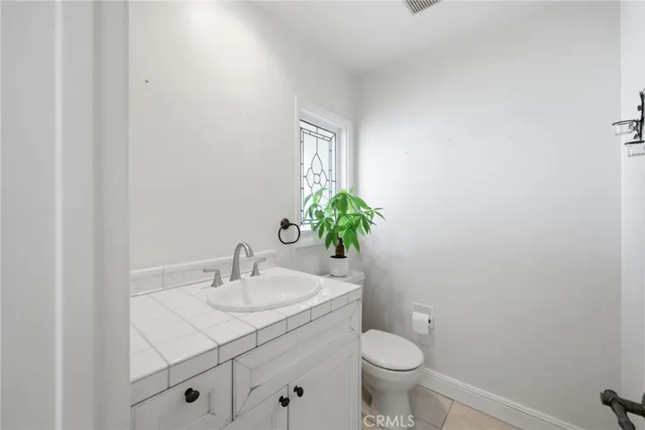 Convenient half bathroom off the kitchen