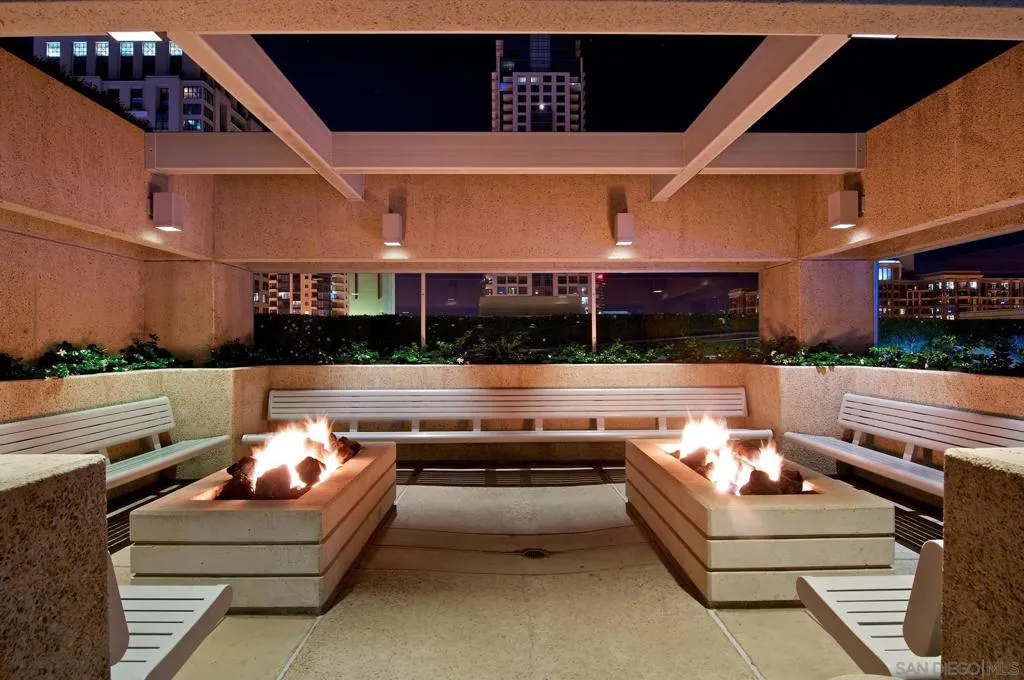 Resort Style Outdoor Heated Pool with spa, cabanas, BBQ's firepit, and lounge areas.