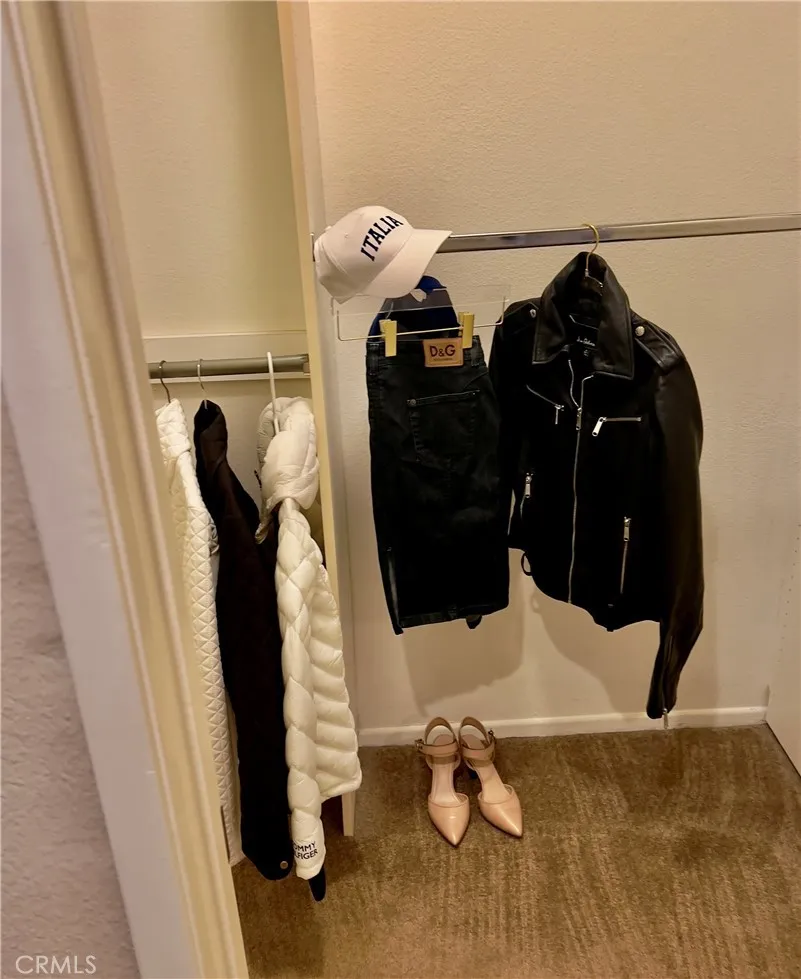 More room to roam with a woman's shopping spree in mind, with 2 walls for hanging clothes and a floor to ceiling shelf for dozens of shoes and accessories...YESSSS!!!