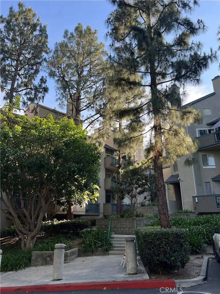 Building exterior with marture trees