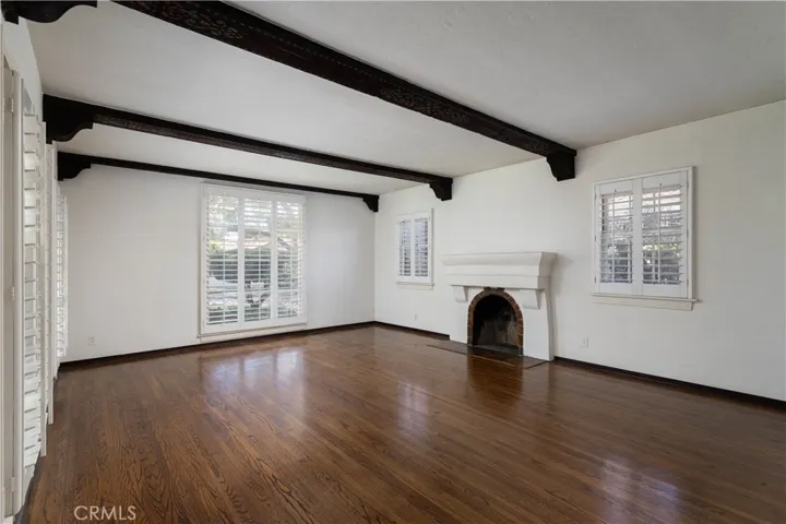 Large living room with stamped ceiling beams