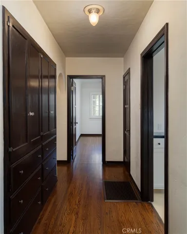 hallway to all bedrooms and to kitchen, lots of cabinet storage