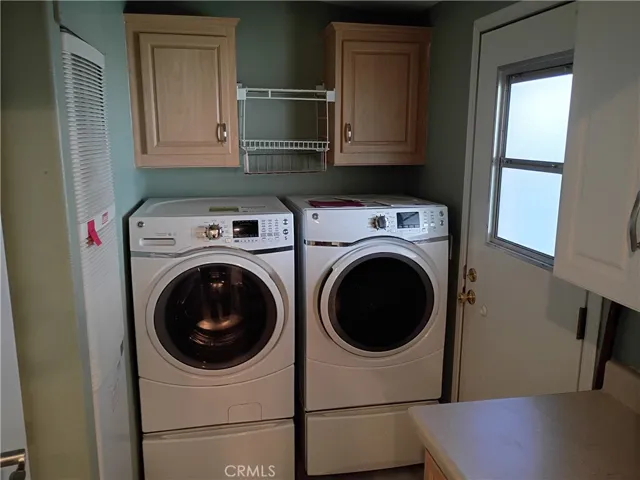 laundry room with storage