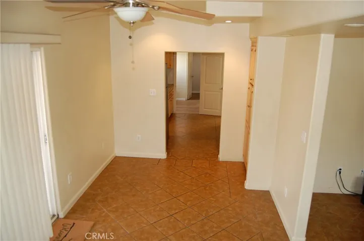 Dinning room conveniently located between the kitchen and the backyard sliding door.