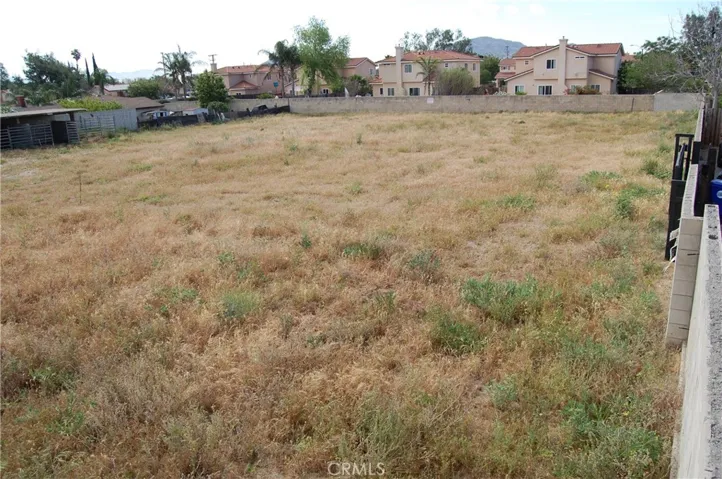 Just imagine what you can do with this much land. Mostly block wall. and rear access gate.