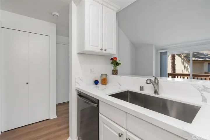 Brand new stacked washer and dryer in the closet off the kitchen