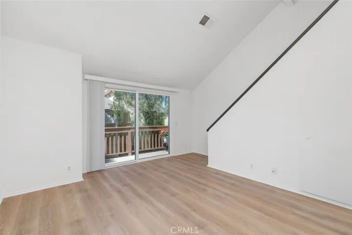 New dual pane sliders allow nature in!  Spacious living room with new flooring, paint and basebords!