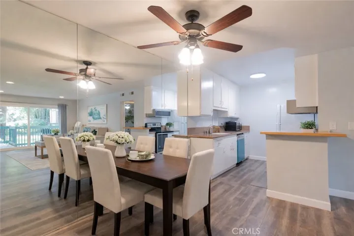 Dining to Kitchen. Photo is virtually enhanced.