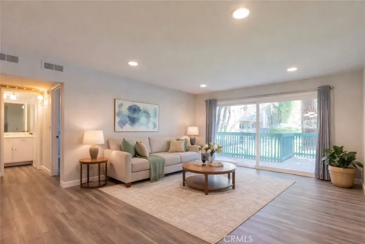 Living Room to Private Extended Balcony. Photo is virtually enhanced.
