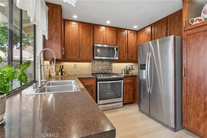 Kitchen w Quartz Counters and Stainless Steel appliances