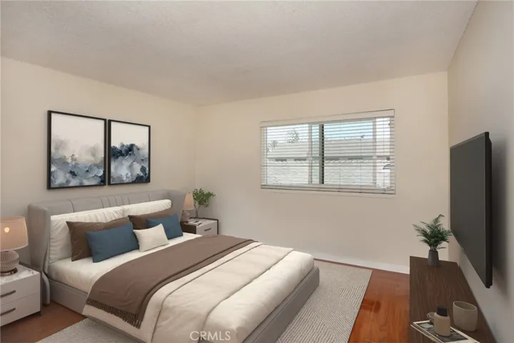 Upstairs 2nd bedroom: Virtual staging shows the home’s potential with stylish, modern updates.