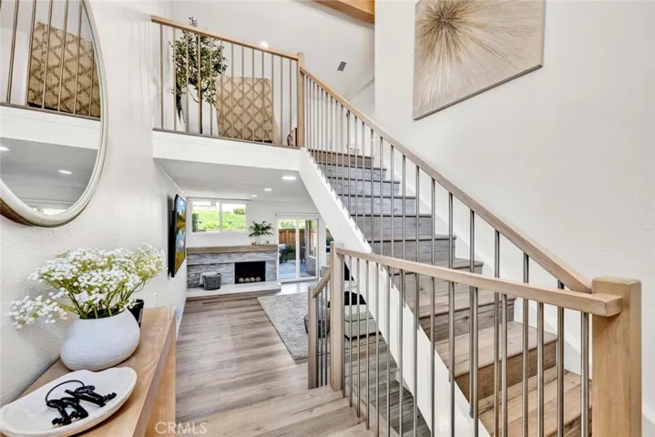 Remodeled stairwell leads upstairs to open loft area