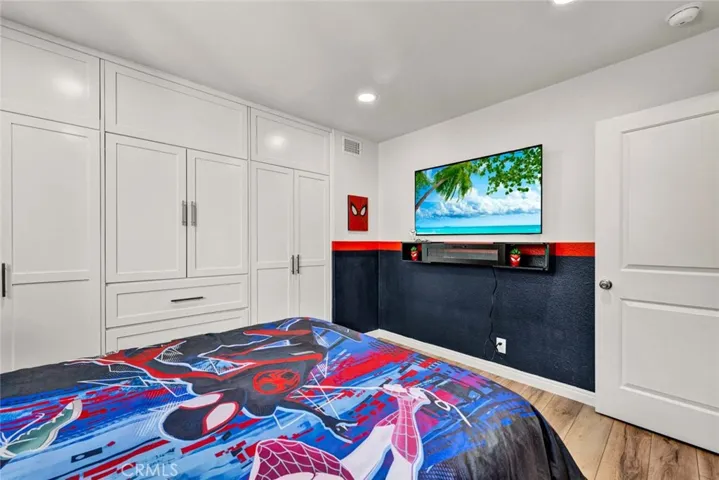 Custom closet organizers in upstairs bedroom