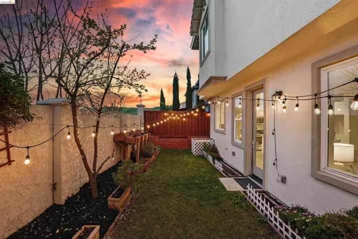 Fenced backyard featuring a wooden deck