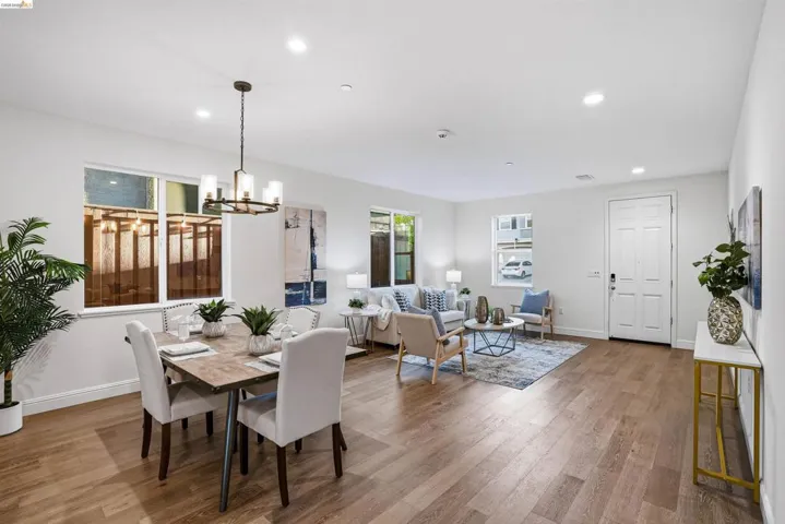 Dining room featuring light wood-style flooring and suspended lighting