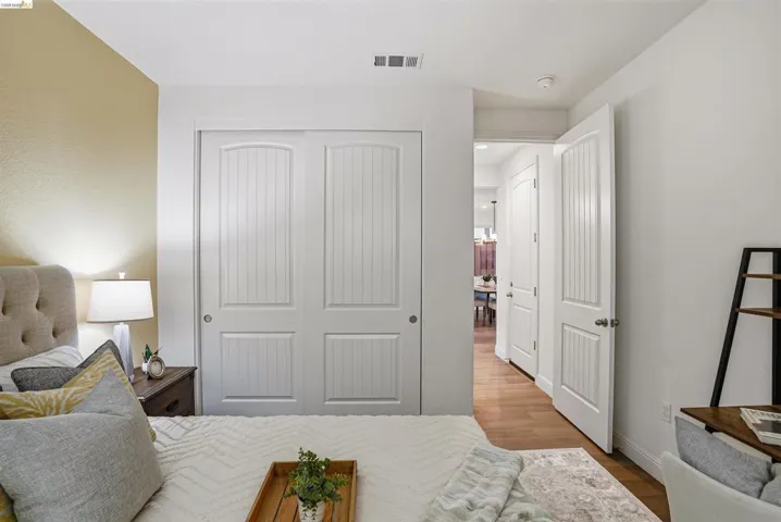 Bedroom featuring a closet and light wood-style flooring