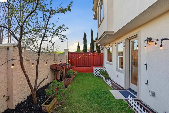 Fenced backyard featuring a wooden deck