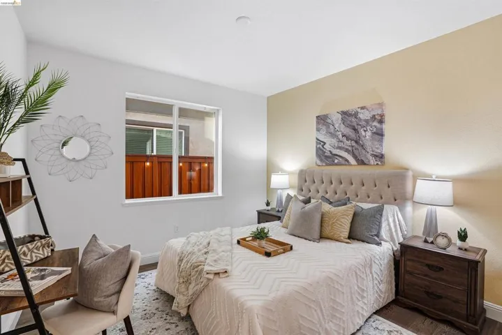 Bedroom with baseboards and wood finished floors