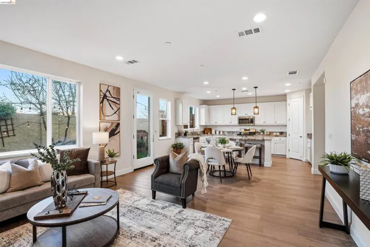 Living room featuring light wood finished floors and recessed lighting