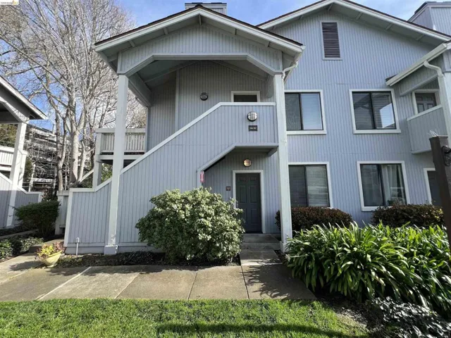 View of property featuring stairs