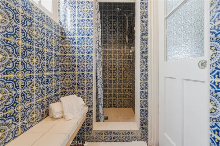 Shower with imported Spanish tile and a matching second shower—ideal for easy off-the-beach access and convenient to the third bedroom.